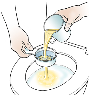 Closeup of hands pouring urine through strainer into toilet.