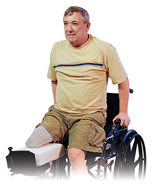 Man with amputated leg sitting in wheelchair doing seated pressup.