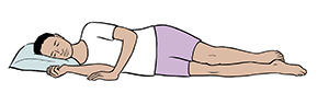 Persona acostada sobre el flanco derecho, con la cabeza apoyada en una almohada.
